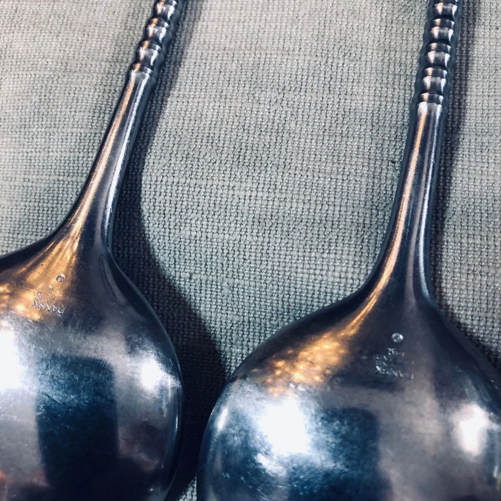 Set of Dansk Jette Stainless Steel flatware and / Four Stainless Steel Pegs
